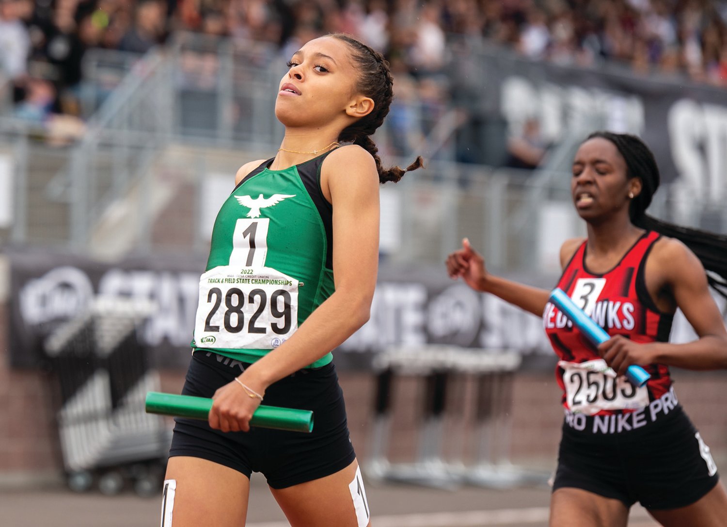 Tumwater's Ava Jones reacts as she crosses the finish line first as the anchor leg in the 2A Girls 4x200 prelim at the 2A/3A/4A State Track and Field Championships on Thursday, May 26, 2022, at Mount Tahoma High School in Tacoma. (Joshua Hart/For The Chronicle)